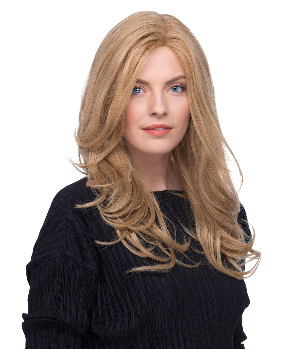 Woman with long blonde hair wearing a black top on a white background